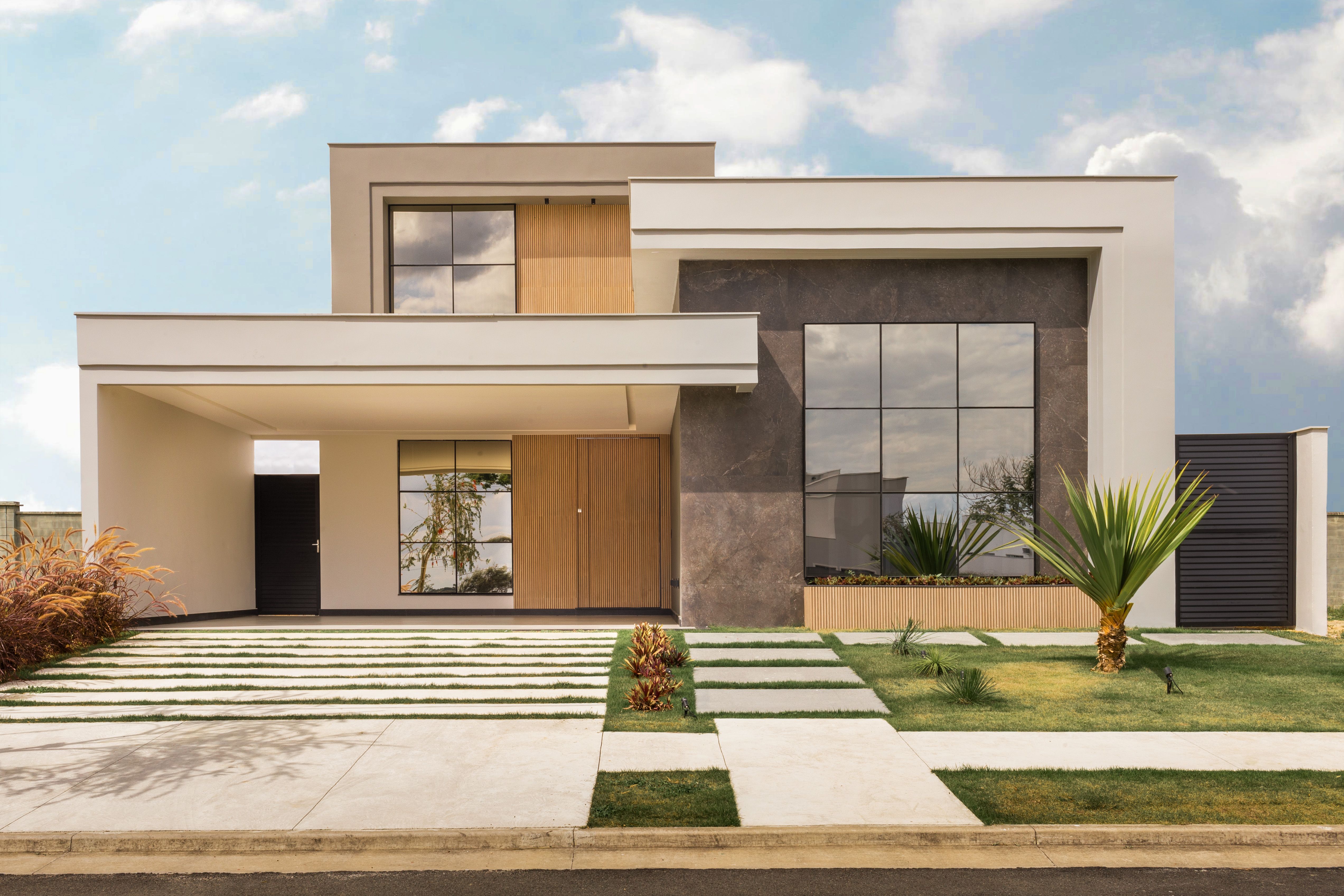 Modern residential home with large windows for a window replacement cost guide